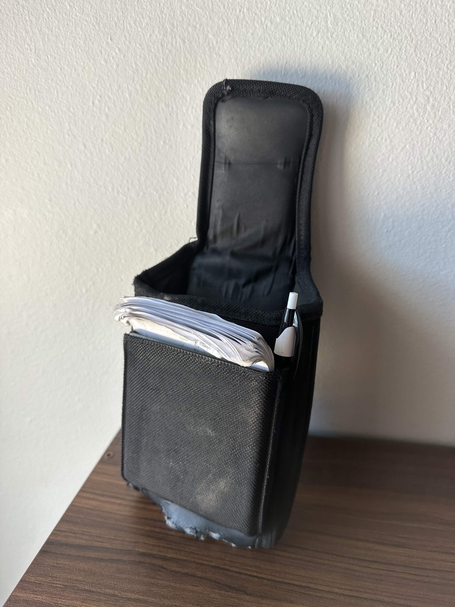 Black pouch organizer loaded with route essentials