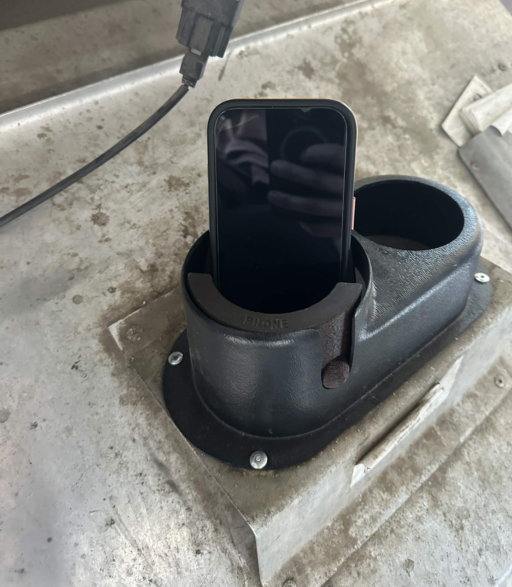 3-in-1 Reversable Cup Holder holding a phone